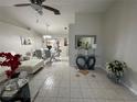 Open living and dining area with white tile floors at 20102 Lorenzo Ave, Port Charlotte, FL 33952