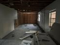 Unfinished interior room, showing exposed studs and wires at 6114 S 3Rd St, Tampa, FL 33611