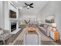 Spacious living room with fireplace and hardwood floors at 7526 Fairlinks Ct, Sarasota, FL 34243