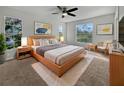 Main bedroom with large windows and modern furniture at 7526 Fairlinks Ct, Sarasota, FL 34243