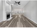 Bright living room with hardwood floors and fireplace at 7526 Fairlinks Ct, Sarasota, FL 34243