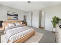Spacious bedroom with light gray carpeting and a large window at 290 Dragon Rd, Venice, FL 34293