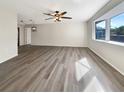 Spacious living room with neutral walls and hardwood flooring at 4143 Waikiki Dr, Sarasota, FL 34241