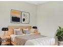 Main bedroom with light walls, a platform bed, and stylish decor at 922 Wynnmere Walk Ave, Ruskin, FL 33570