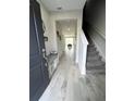 Bright and spacious entryway with tile floors and staircase at 10922 Brightleaf Ct, Riverview, FL 33569