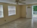 Living Room with tile floors and ceiling fan at 3023 W Green St, Tampa, FL 33607
