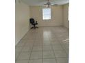 Bedroom with tile floor and ceiling fan at 3023 W Green St, Tampa, FL 33607