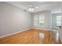 Bright living room with hardwood floors, ceiling fan, and large windows at 1810 E Palm Ave # 1205, Tampa, FL 33605