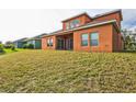 Two-story house with a large backyard and a covered patio at 612 Marion Hill Ln, Ruskin, FL 33570