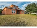 Two-story house with a large backyard and a covered patio at 612 Marion Hill Ln, Ruskin, FL 33570
