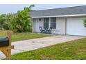 Cozy ranch home with two-car garage and small front yard at 3310 W 63Rd W St, Bradenton, FL 34209