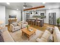 Open concept living room and kitchen with modern design at 736 Mac Crillus Rd, Largo, FL 33770