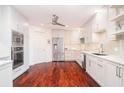 Updated kitchen featuring white shaker cabinets and granite countertops at 340 S Palm Ave # 11, Sarasota, FL 34236