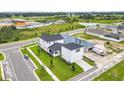 Two-story house and detached garage viewed from above at 3611 Lajuana Blvd, Wesley Chapel, FL 33543