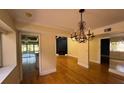 Elegant dining room with hardwood floors and chandelier at 13619 Twin Lakes Ln # 15, Tampa, FL 33618