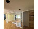 Bright living room with hardwood floors and access to other rooms at 13619 Twin Lakes Ln # 15, Tampa, FL 33618