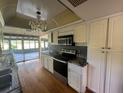 Kitchen with granite countertops and stainless steel appliances at 13619 Twin Lakes Ln # 15, Tampa, FL 33618