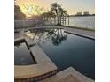 Relaxing pool and spa overlooking the water at sunset at 501 55Th Ave, St Pete Beach, FL 33706