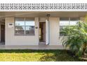 Condo building entryway with open door and green grass at 5095 Bay Ne St # 109, St Petersburg, FL 33703