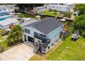 Two-story waterfront home with a large yard and dock at 6728 Sea Ranch Dr, Hudson, FL 34667