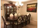 Elegant dining room with a large table and beautiful chandelier at 26273 Lancer Ln, Punta Gorda, FL 33983