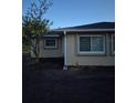 View of home's side exterior featuring newly laid dirt and windows at 21300 Washburn Ave, Port Charlotte, FL 33952