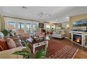 Spacious living room with hardwood floors, fireplace, and comfortable seating at 4049 Cobia Dr, Hernando Beach, FL 34607