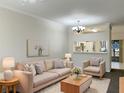 Bright living room features a neutral color palette and comfortable seating at 2346 Lake Woodberry Cir, Brandon, FL 33510