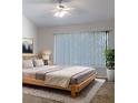 Large main bedroom with a plush bed and plenty of natural light at 2346 Lake Woodberry Cir, Brandon, FL 33510