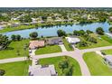 Stunning aerial view of a waterfront neighborhood with lush landscaping and a serene river at 7384 Van Lake Dr, Englewood, FL 34224