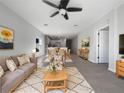 Open concept living room and dining area with modern finishes at 6223 Springmont Loop, Palmetto, FL 34221