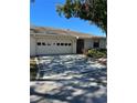 Newly paved driveway with a modern checkerboard pattern at 2513 Lancaster Dr, Sun City Center, FL 33573