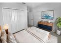 Bright bedroom with double doors leading to a spacious closet at 17827 Turning Leaf Cir, Land O Lakes, FL 34638