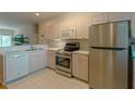 Clean kitchen with stainless steel appliances and light-colored cabinetry at 3919 Cape Haze Dr # 503, Rotonda West, FL 33947