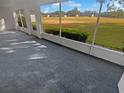 Relaxing screened porch overlooking a lush green landscape at 6844 Northlake Dr, Zephyrhills, FL 33542