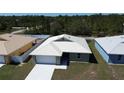 Well-placed single-story home with a lush lawn and modern metal roof in a quiet neighborhood at 12263 Cartouche Ave, Punta Gorda, FL 33955