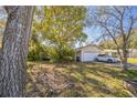 House exterior showcasing a carport and a white car parked in the driveway at 6434 River Ridge Rd, New Port Richey, FL 34653