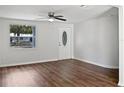 Spacious living area with hardwood floors and an entryway at 10009 Connecticut St, Gibsonton, FL 33534