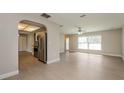 Open concept living and kitchen area with stainless steel appliances at 23104 Newcun Ave, Punta Gorda, FL 33980