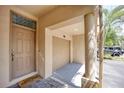 Exterior view of condo showing front door, garage, and a columned entryway at 875 Normandy Trace Rd, Tampa, FL 33602