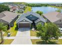 Single-Gathering home with lake view in a residential community at 14308 Edinburgh Moor Dr, Wimauma, FL 33598