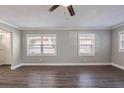 Spacious living area with large windows, wood-look floors, and neutral gray walls at 2558 12Th S Ave, St Petersburg, FL 33712