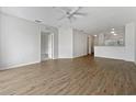 Spacious, unfurnished living room with wood-look flooring at 2061 Willow Hammock Cir # 107, Punta Gorda, FL 33983