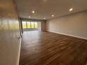 Spacious living room with wood-look flooring and large windows at 314 Spring Lakes Blvd # 314-U, Bradenton, FL 34210