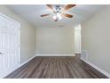 Spacious bedroom with hardwood floors and neutral walls at 3723 N Garrison St, Tampa, FL 33619