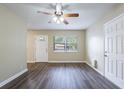 Bright living room with hardwood floors and ceiling fan at 3723 N Garrison St, Tampa, FL 33619