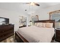 Comfortable main bedroom suite featuring a ceiling fan and neutral decor at 4920 Sedeno Dr, Zephyrhills, FL 33541