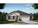 Inviting single-story home with a covered entryway and spacious two-car garage at 11435 Petrel Ave, Weeki Wachee, FL 34614