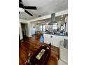 Inviting living room showcases hardwood floors, opening to the kitchen and dining area at 1535 35Th N Ave, St Petersburg, FL 33704