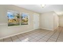 Bright dining area with tile floors and large window at 205 Larson Ave, Brandon, FL 33510